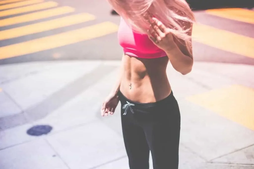 Woman with toned stomach after LA-EMS Body Sculpting Treatment Barnes